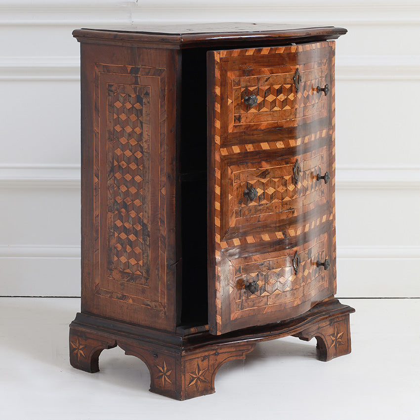 Wooden cabinet with intricate patterns on a white background
