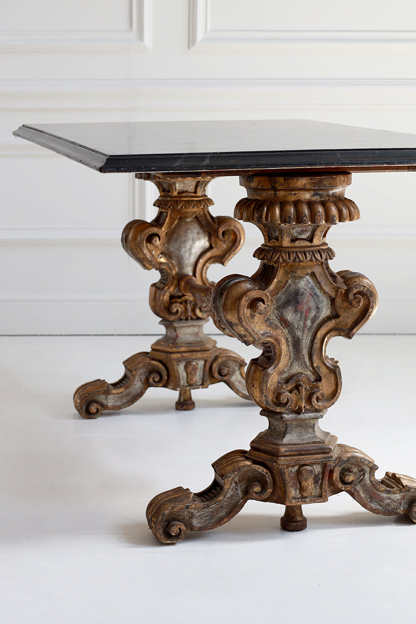 Decorative wooden table with intricate carvings on a white background