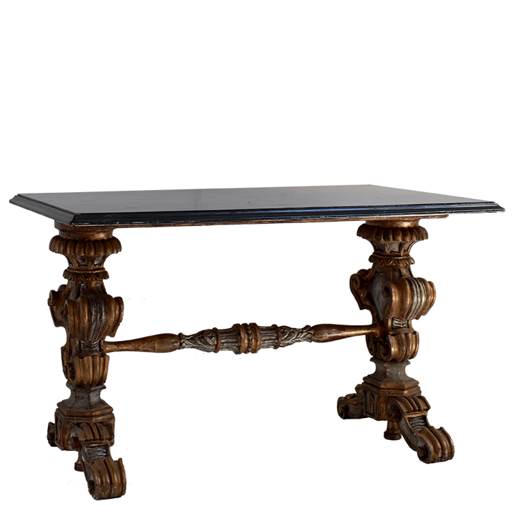 Decorative table with intricate wooden legs on a white background