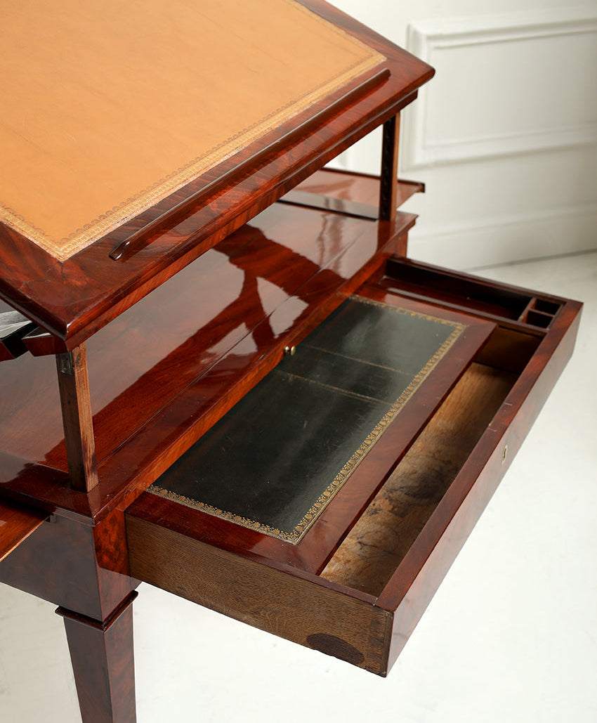 Wooden drafting table with leather surface on a white background