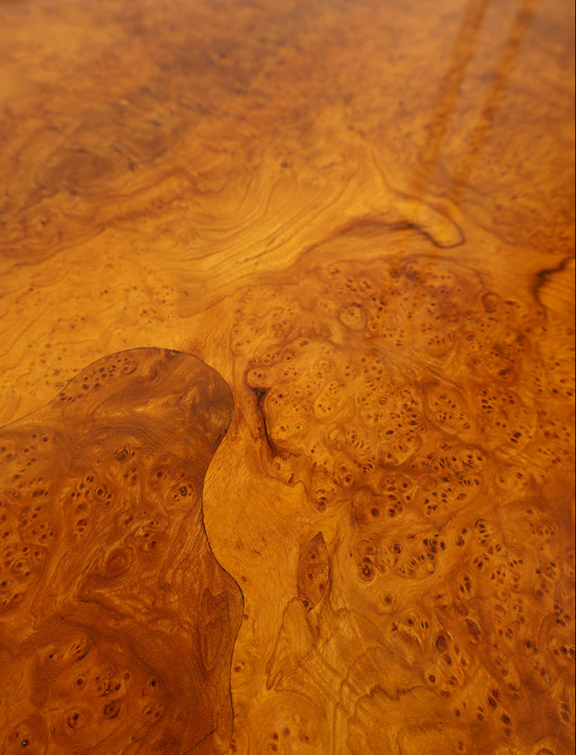 Close-up of a wooden surface with a burl pattern
