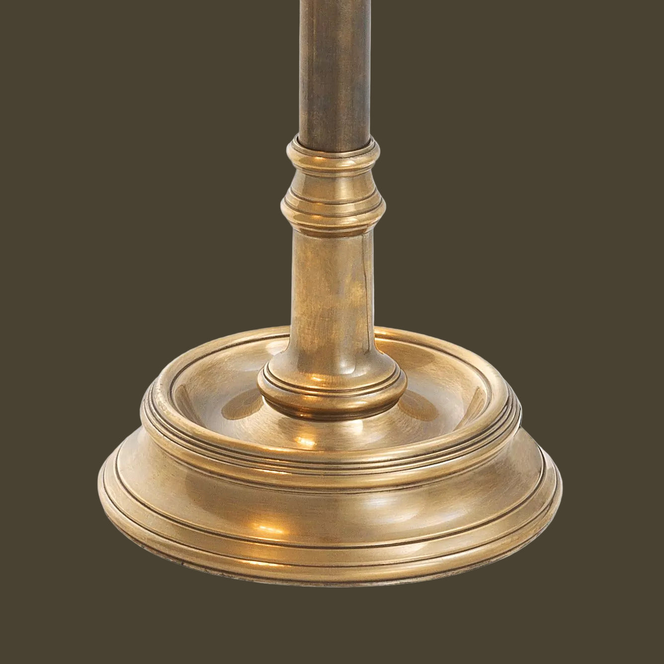 Brass lamp base on a white background