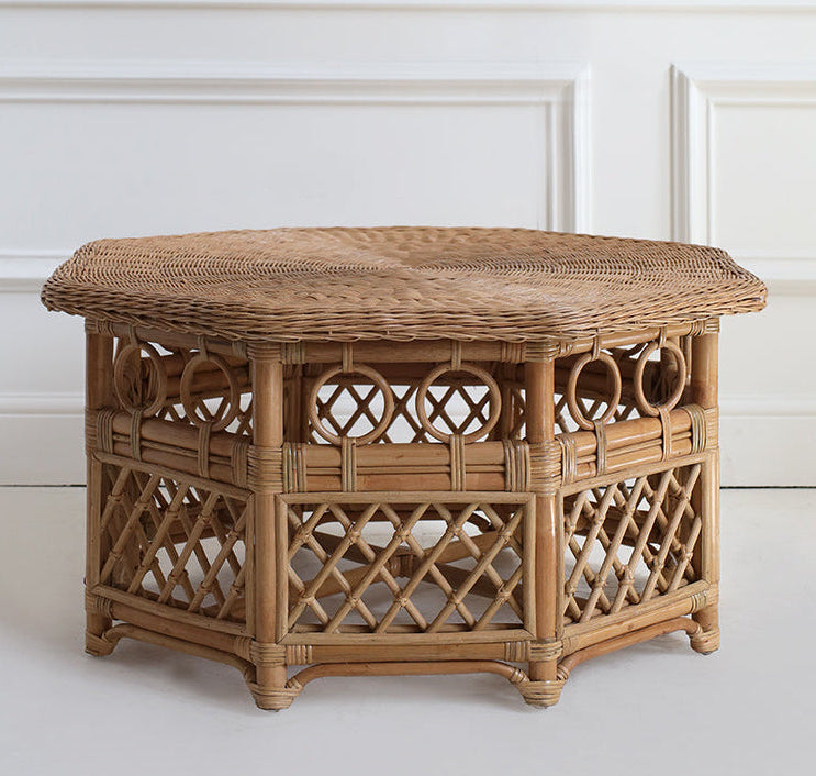 Wicker side table against a white wall