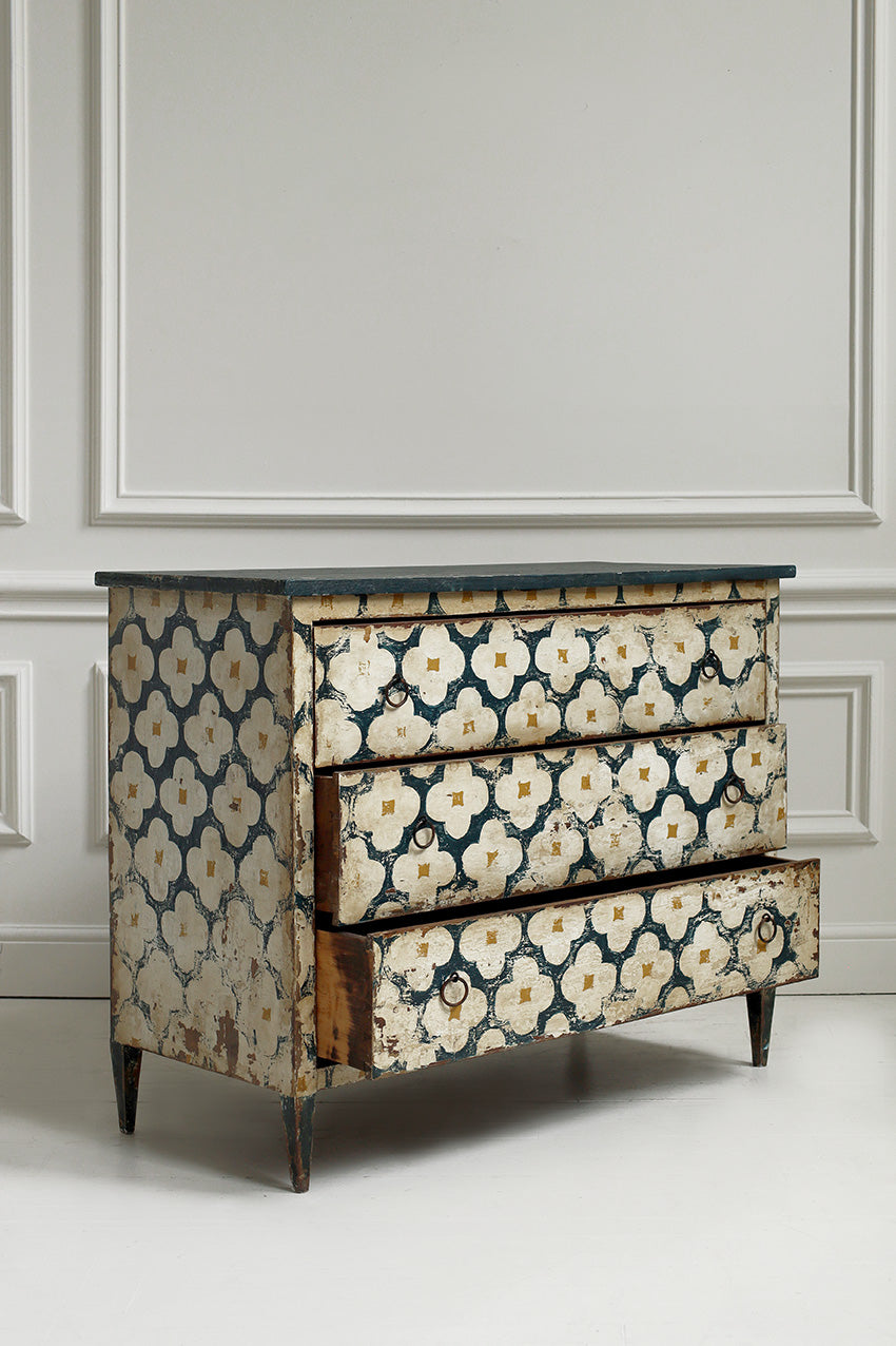 Decorative dresser with floral pattern on a neutral background