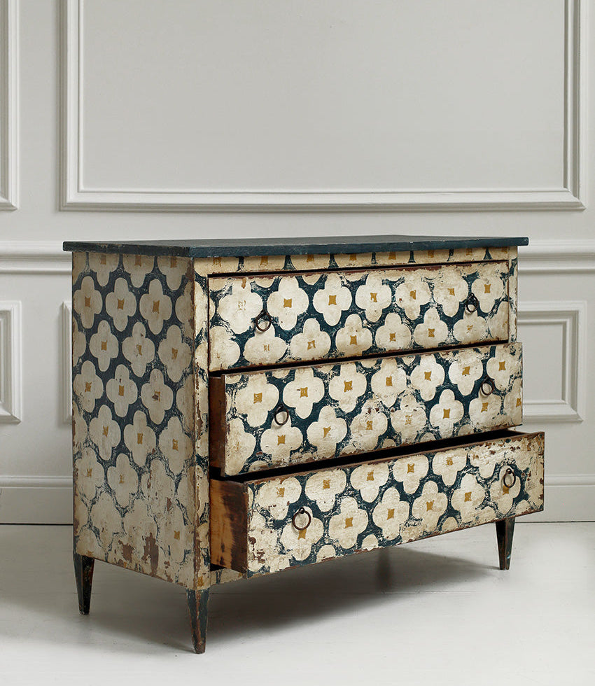 Decorative dresser with floral pattern on a neutral background