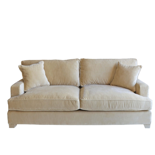 Beige sofa with two cushions on a white background