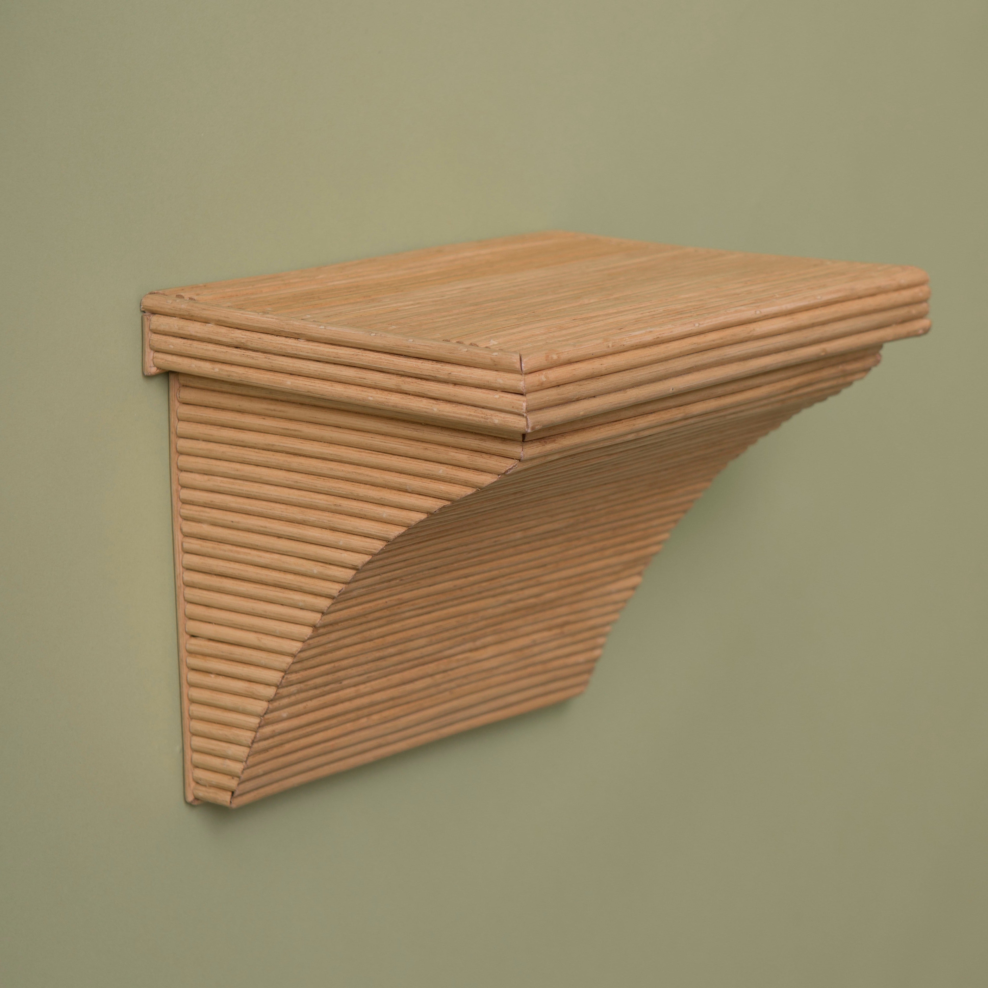 rattan shelf bracket on a green background