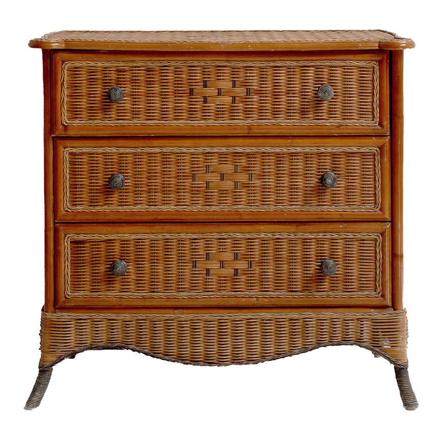 Wicker chest of drawers with three drawers on a white background