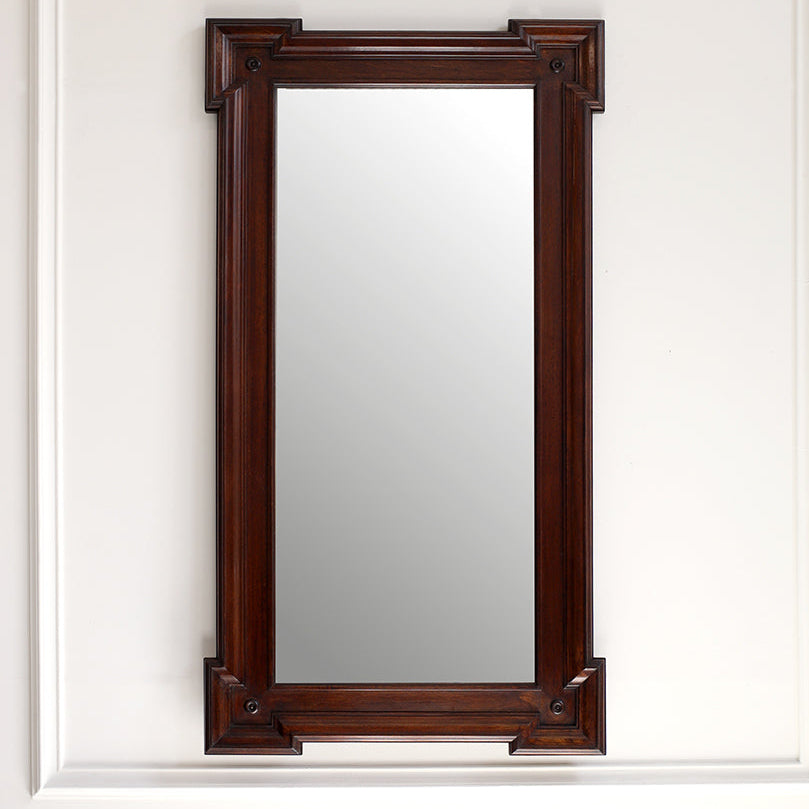 Wooden framed mirror on a white wall