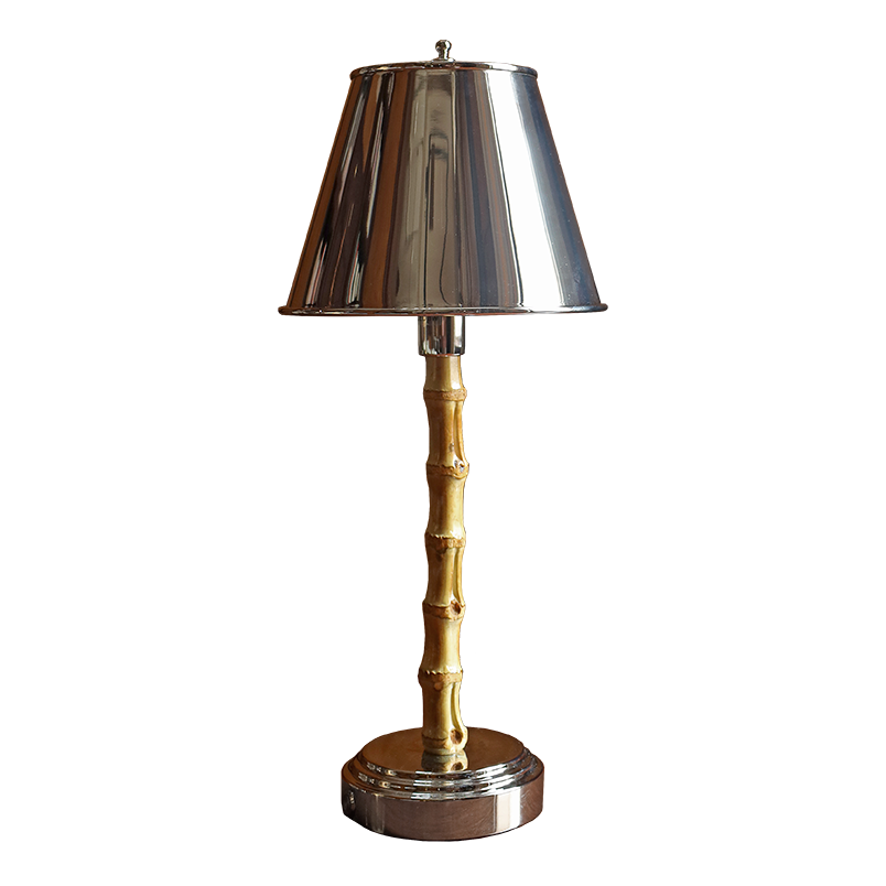 A table lamp with a polished silver metal shade and base, and a gold-finished bamboo-style central stem, shown on a plain white background.