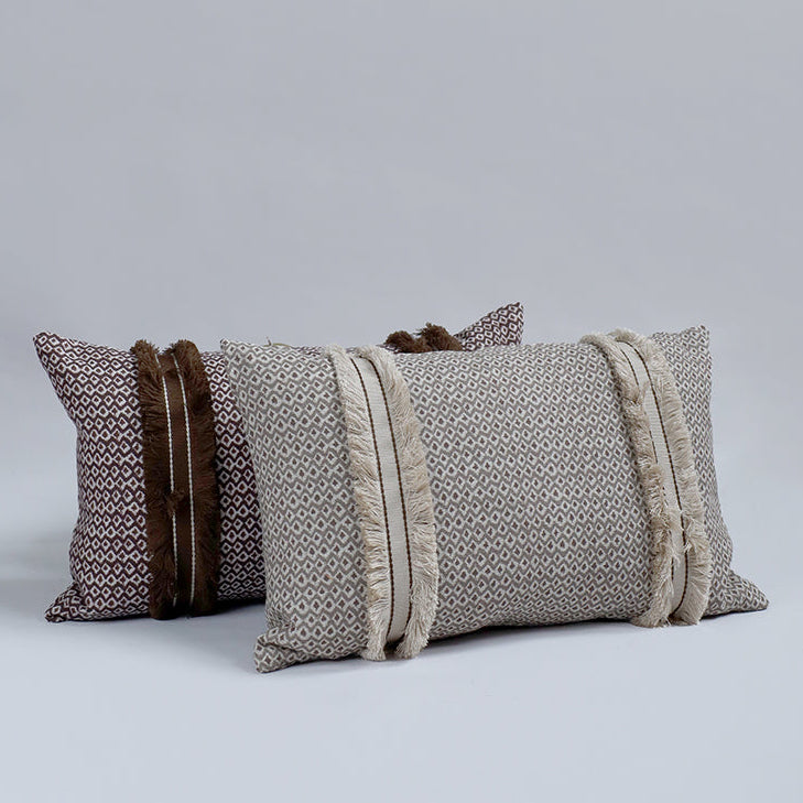 Three decorative pillows with patterned designs on a light gray background