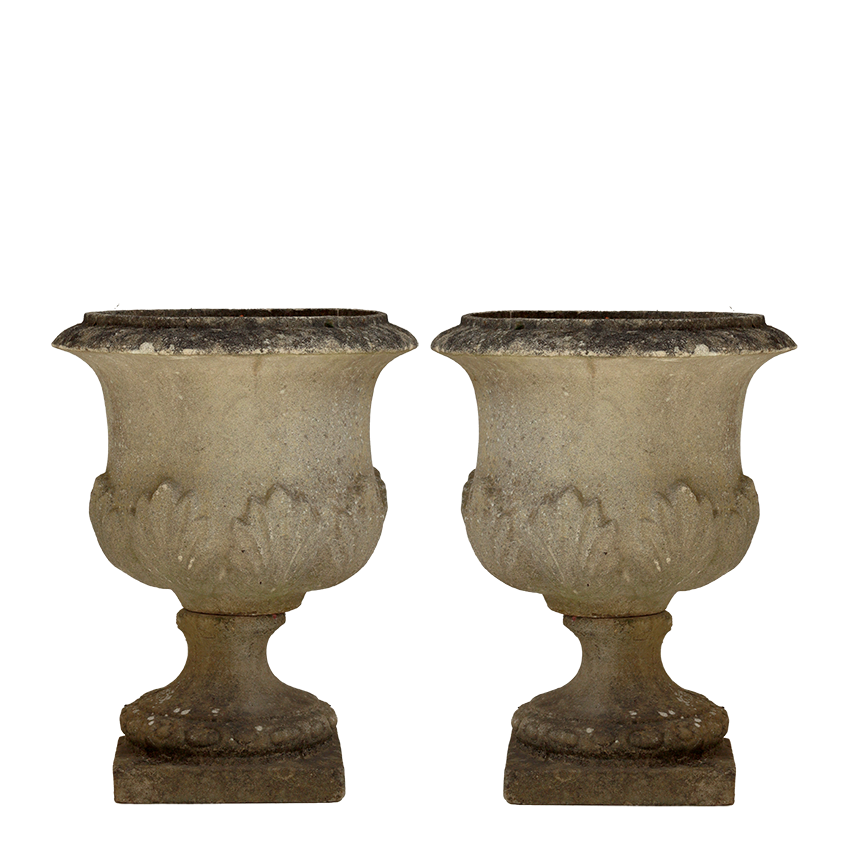 Two vintage-style stone urns on a white background