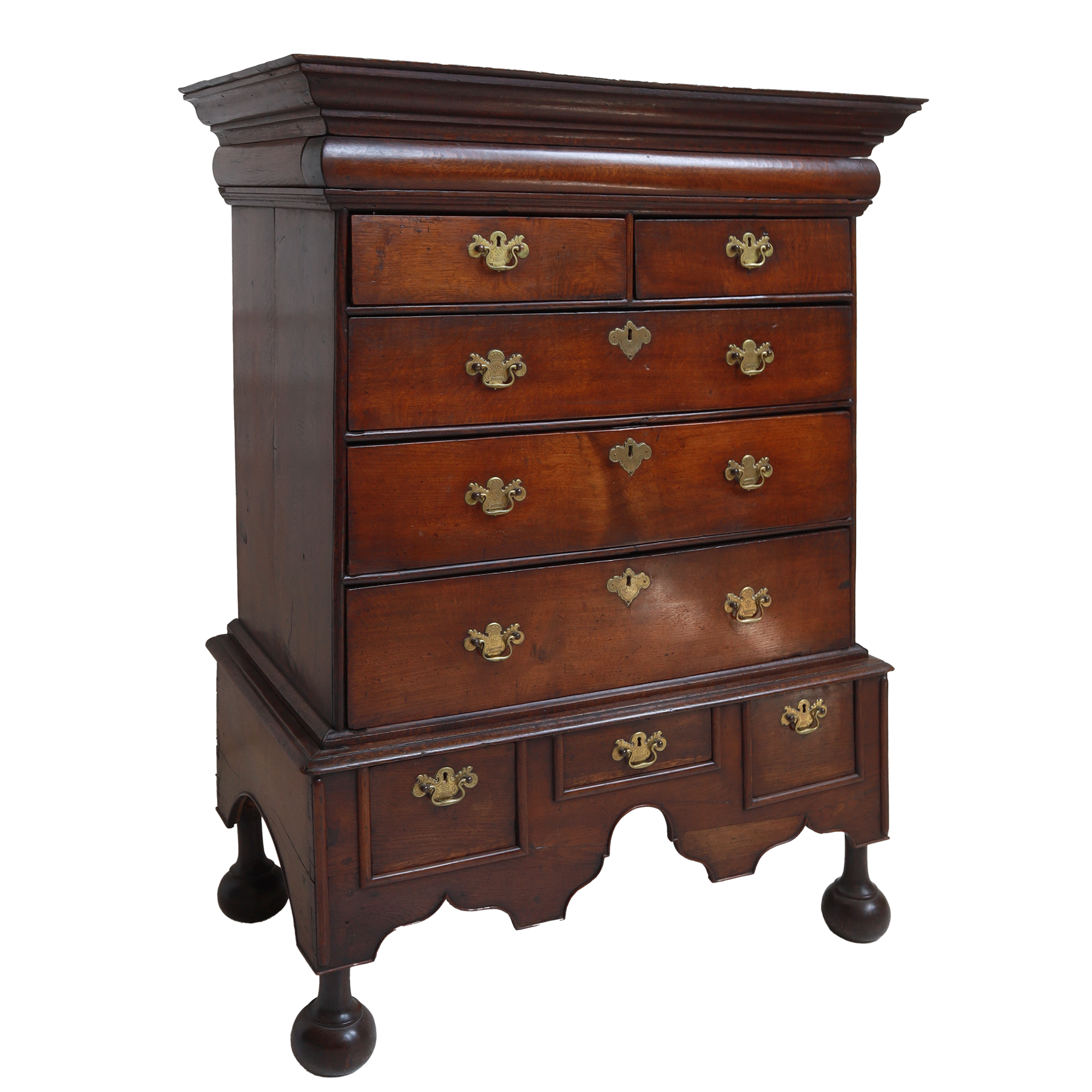 Wooden dresser with multiple drawers and brass handles on a white background