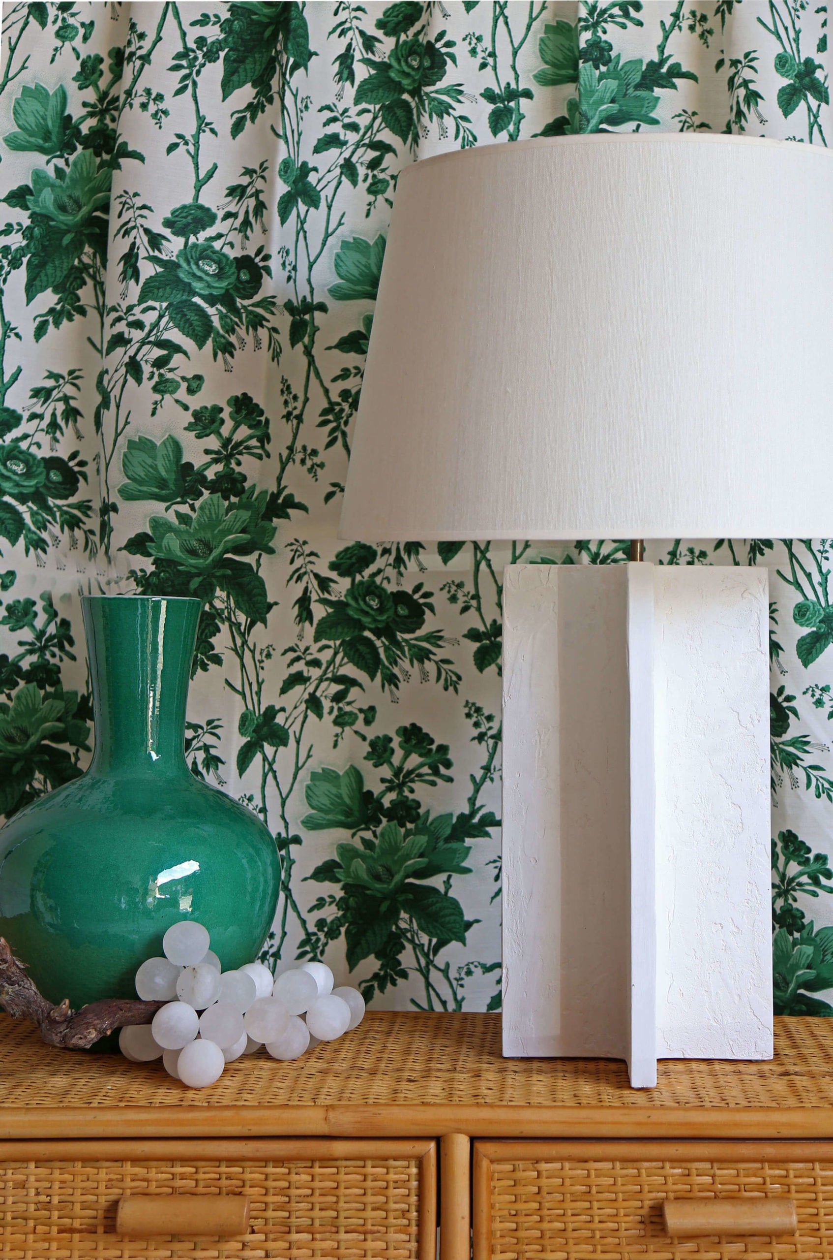 Vignette.De La Tour Paolo’s Green.Michel Table Lamp.Nino Rattan Console.Alabaster Grapes