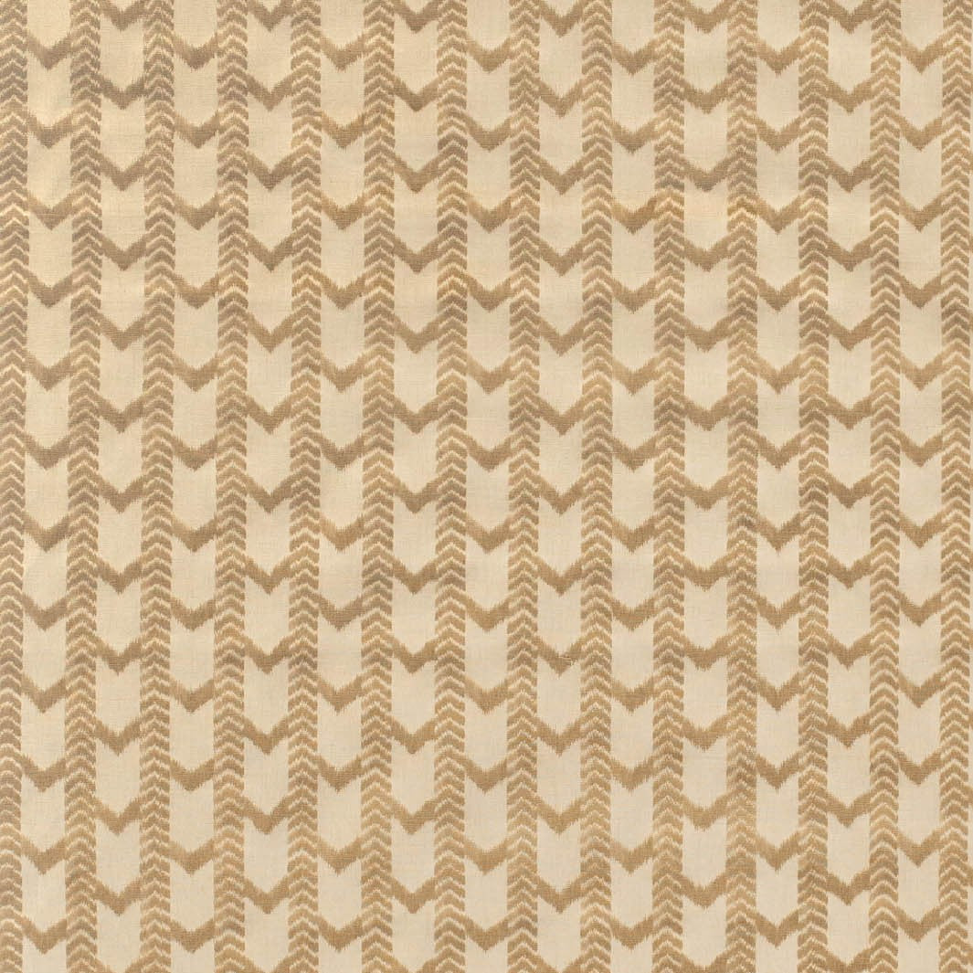 Textured patterned fabric swatch in beige and brown tones