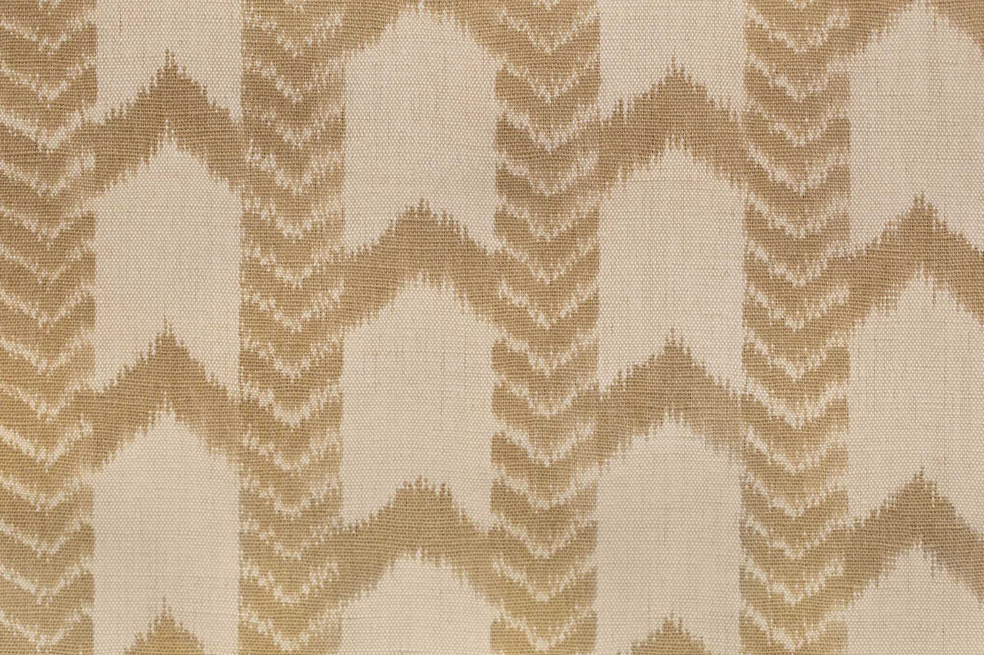 Textile pattern with brown and beige zigzag design on a fabric background