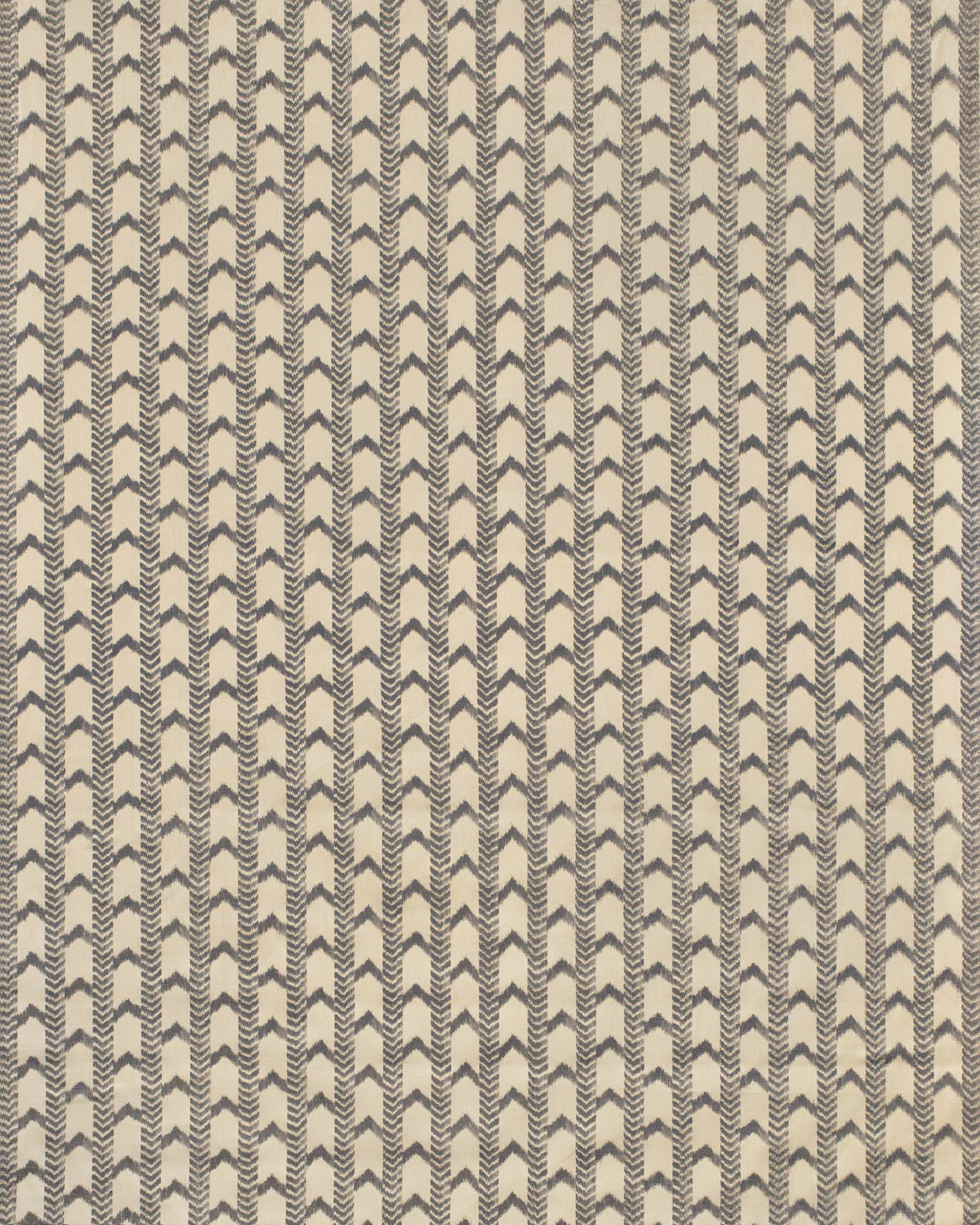Textile pattern with black and white zigzag design on a beige background