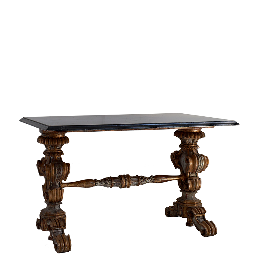 Decorative table with intricate wooden legs on a white background