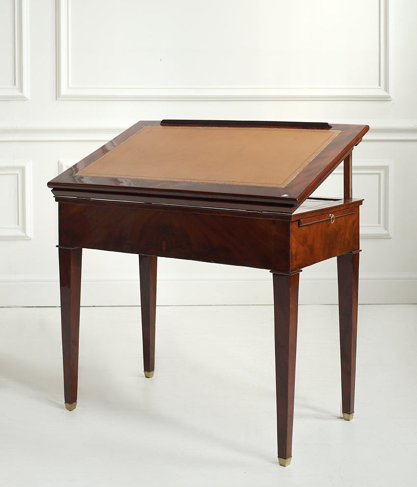 Wooden drafting table with leather surface on a white background