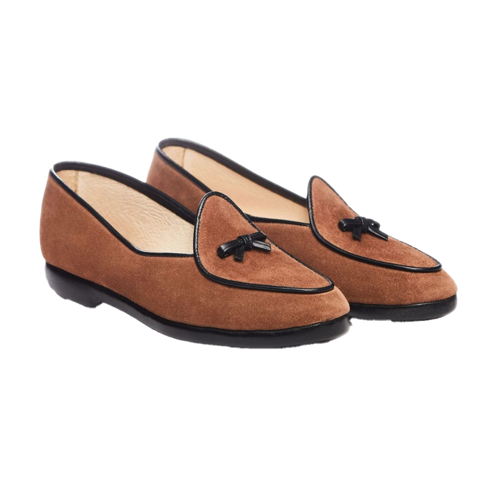 Pair of brown loafers with black accents on a white background