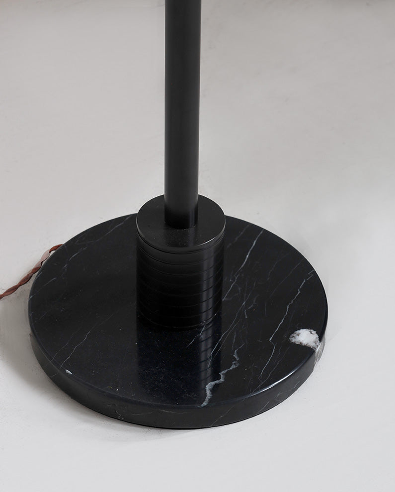 Black marble base on a white surface