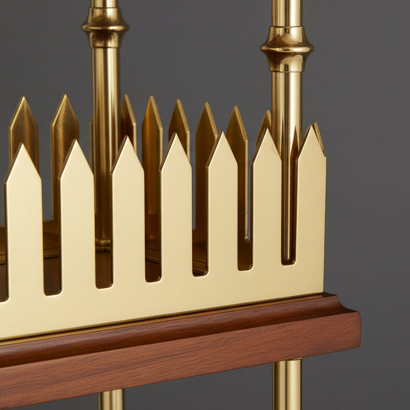 Close-up of a decorative object with gold and wooden elements on a white background