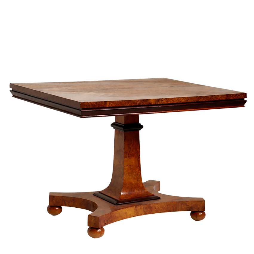 Wooden table with a pedestal base on a white background