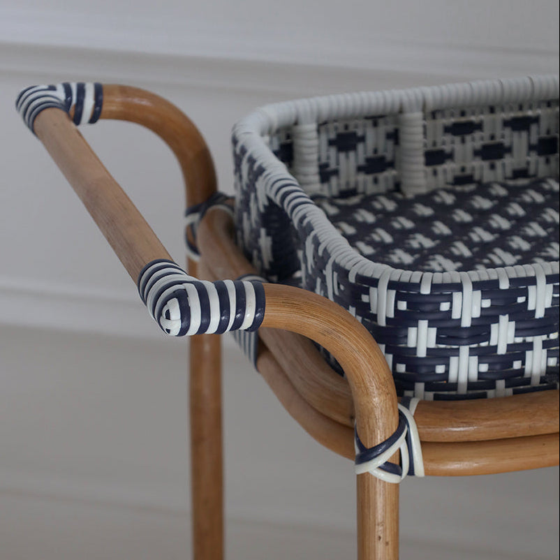 Rattan chair with woven seat and backrest on a plain background