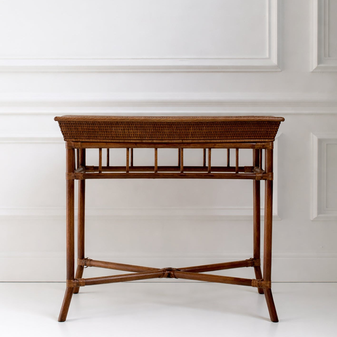 Wooden side table against a white wall