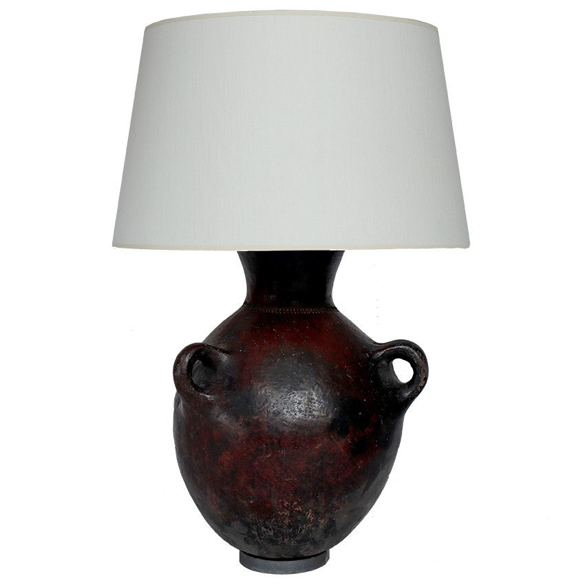 Decorative lamp with a dark brown ceramic base and a white lampshade on a white background