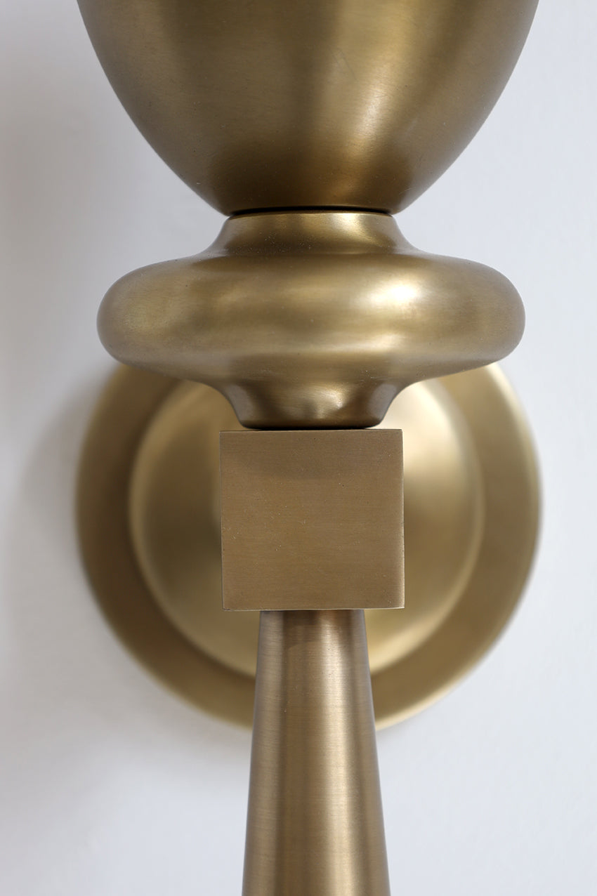 Close-up of a brass door handle on a white background