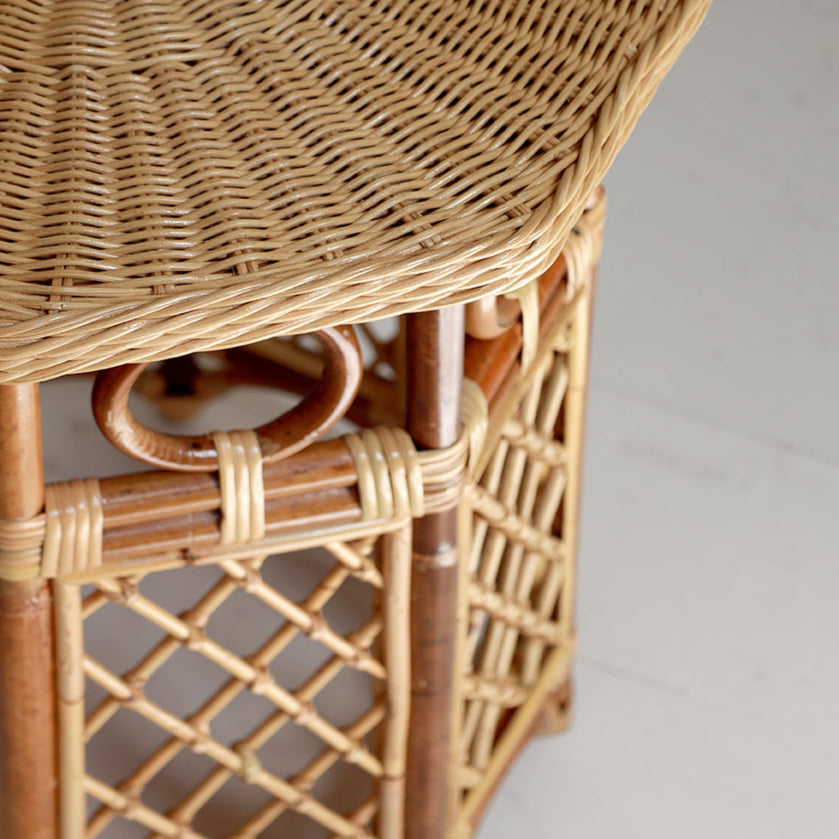 Close-up of a wicker table with a neutral background