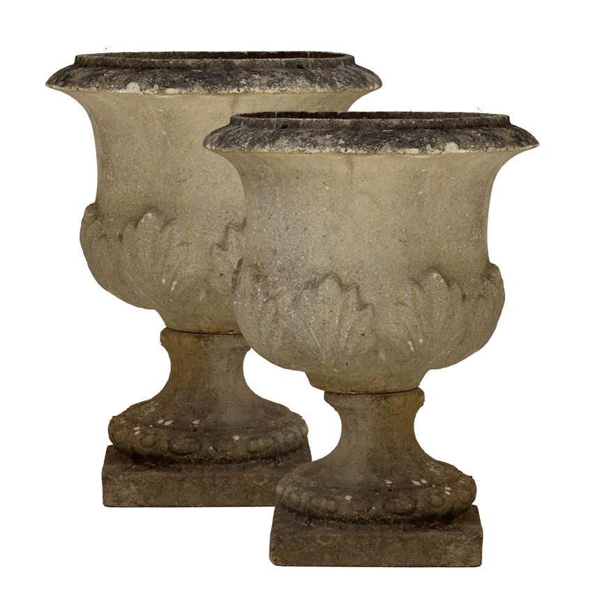 Two stone urns on a white background
