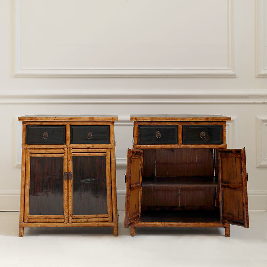 Two wooden cabinets with open doors on a white background