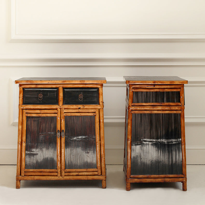 Two wooden side tables with a dark finish against a white wall.