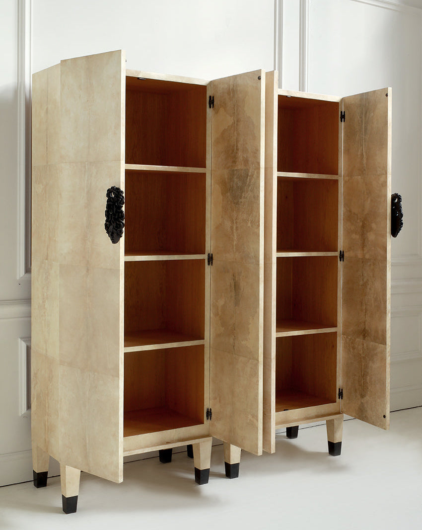 Wooden wardrobe with open doors on a white floor and wall background