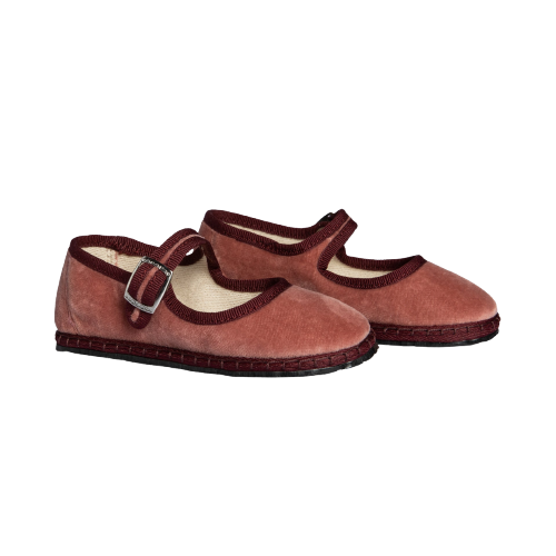 Pair of brown shoes with buckles on a white background