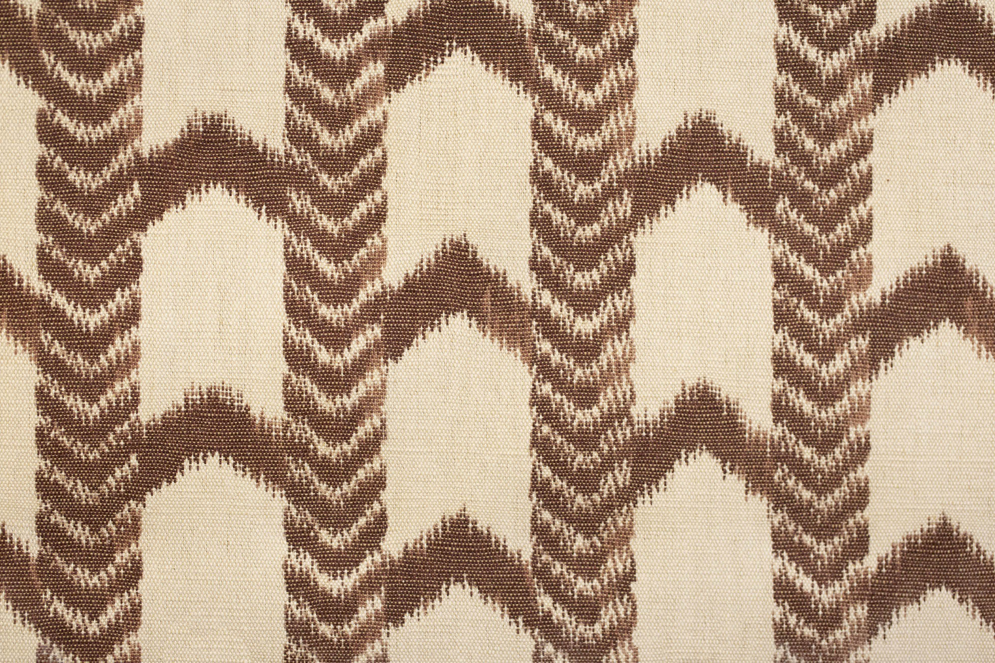 Textile with brown and beige zigzag pattern on a beige background
